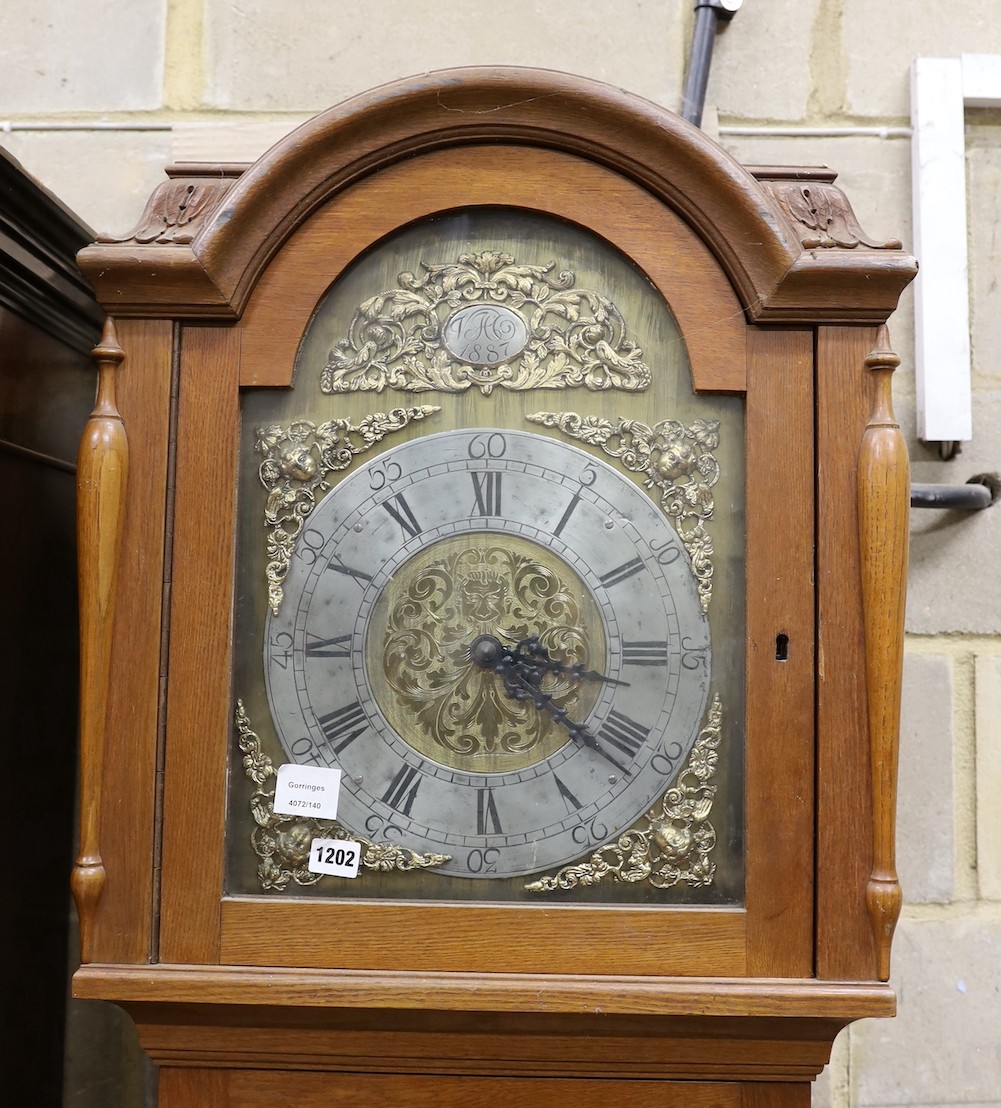 A late 19th century Danish oak cased thirty hour longcase clock, with dial dated 1887, height 220cm
